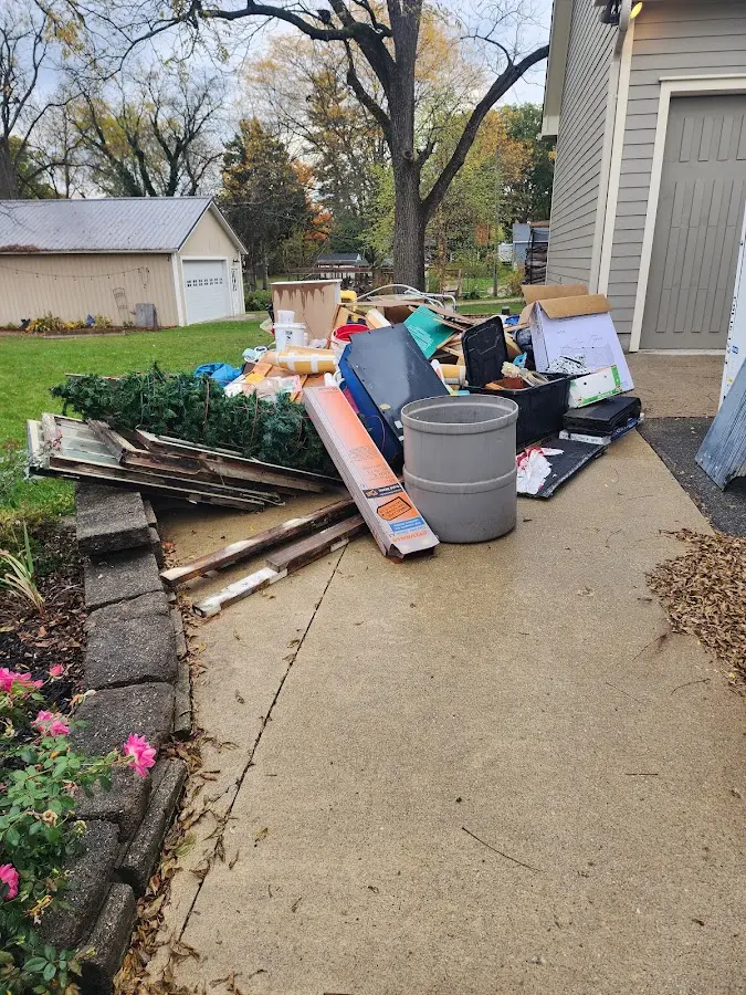 Dumpster being loaded with debris for Estate Cleanout Dumpster Rental in Somers